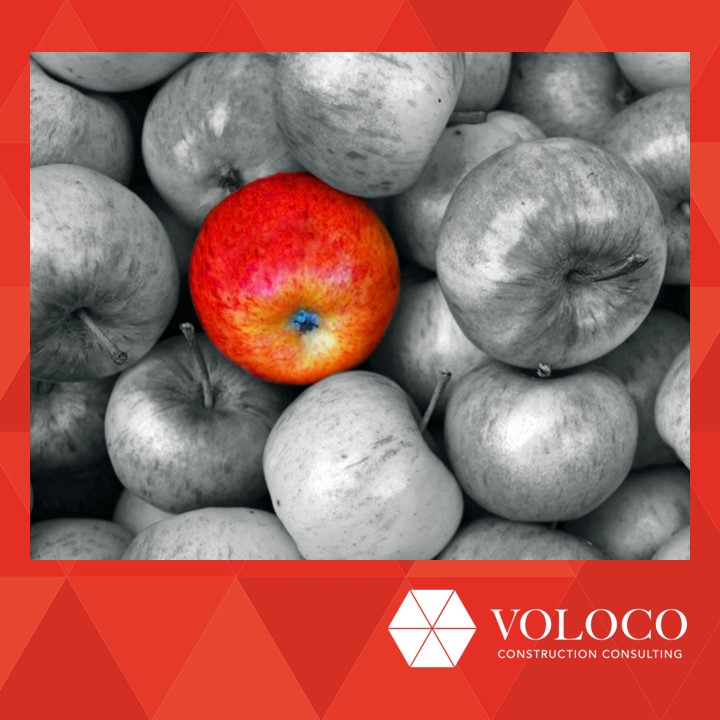 Red apple among grey apples