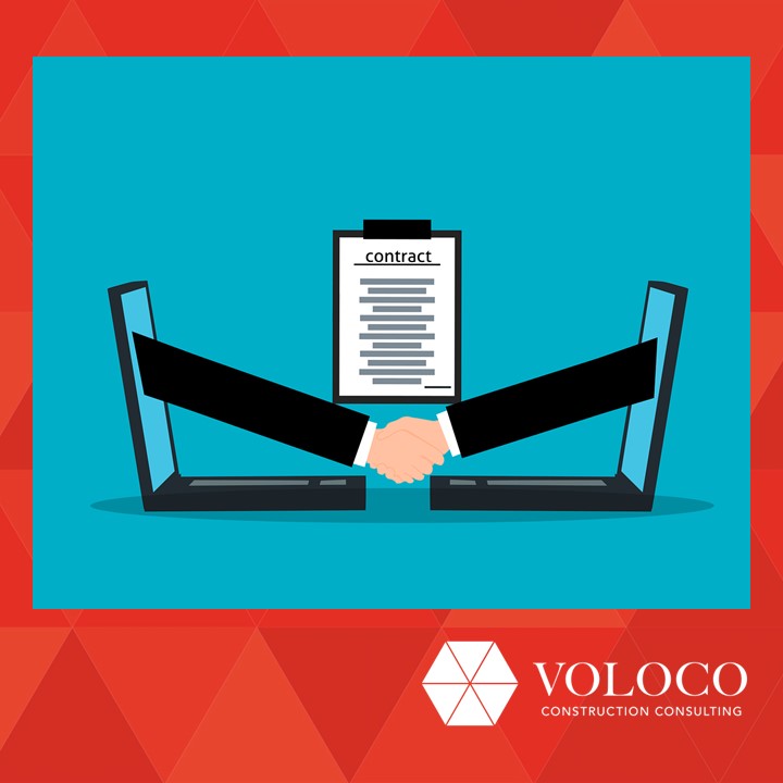 A handshake reaching out between laptops with a contract law document in the background.
